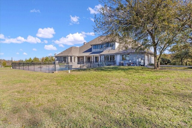 back of house with a yard