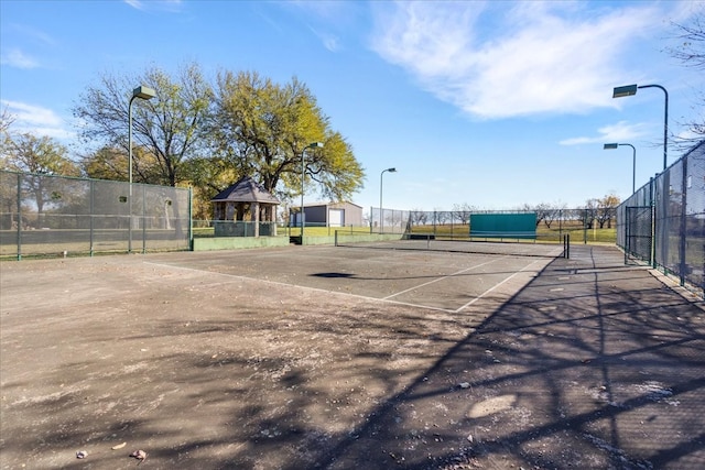 view of tennis court featuring a gazebo