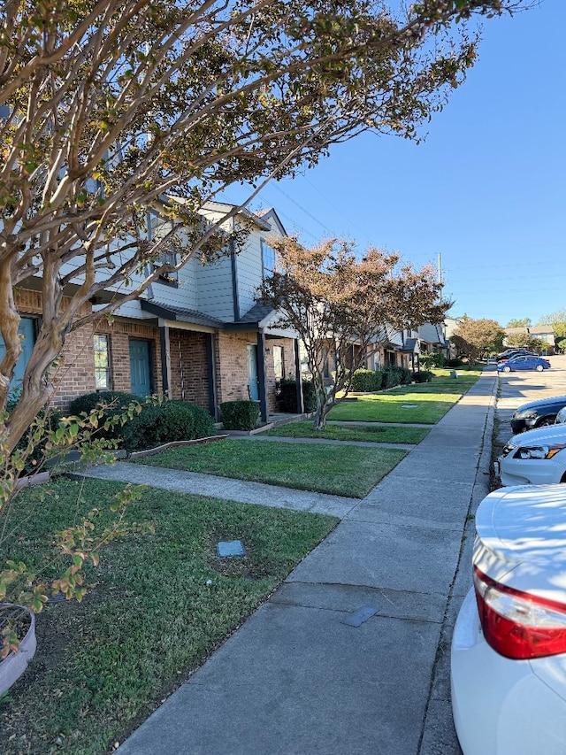 view of front of property with a front lawn