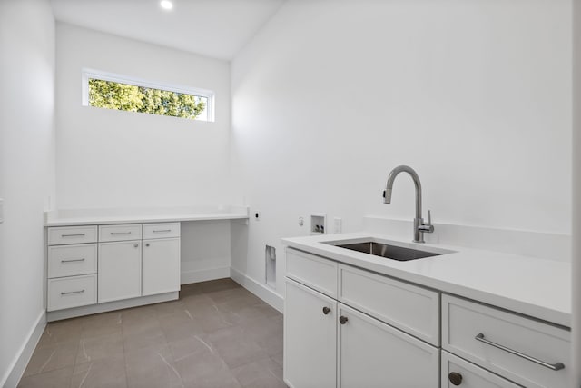 washroom featuring cabinets, washer hookup, electric dryer hookup, and sink