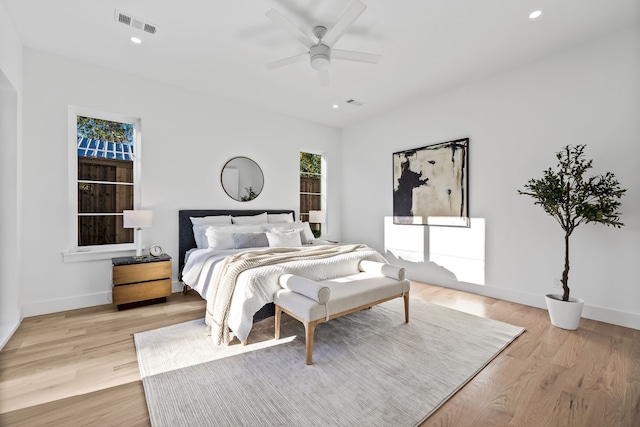 bedroom featuring ceiling fan and light hardwood / wood-style floors