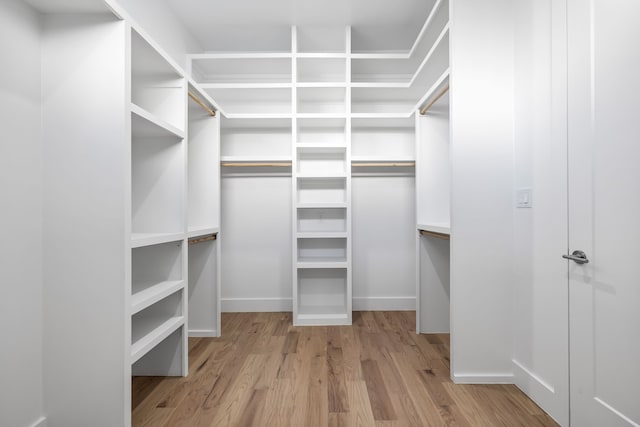 walk in closet featuring light hardwood / wood-style flooring