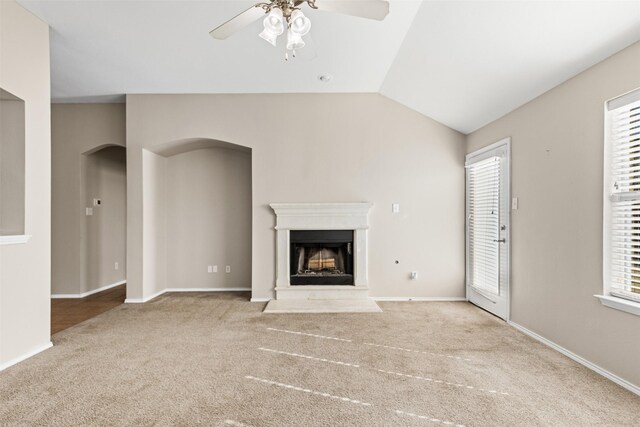 kitchen featuring a center island, lofted ceiling, sink, decorative backsplash, and stainless steel appliances