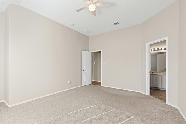 living room featuring carpet floors and lofted ceiling