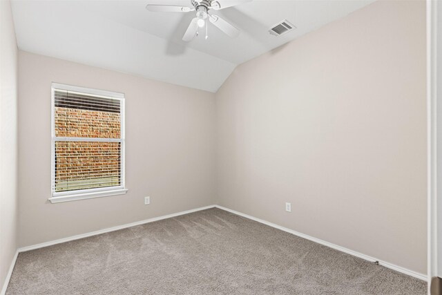 bedroom featuring connected bathroom, ceiling fan, light carpet, and lofted ceiling