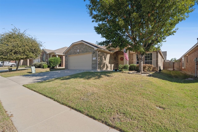 view of front of home with a front yard and a garage