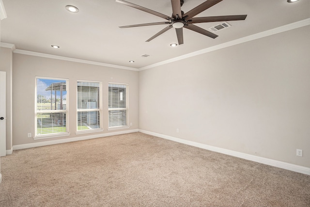 unfurnished room with crown molding, carpet floors, and ceiling fan