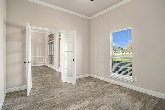 spare room featuring ceiling fan, ornamental molding, dark wood-type flooring, and french doors