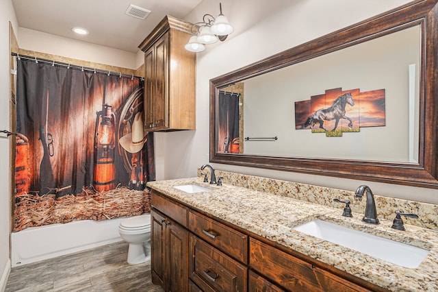 full bathroom with toilet, vanity, shower / tub combo, and hardwood / wood-style flooring