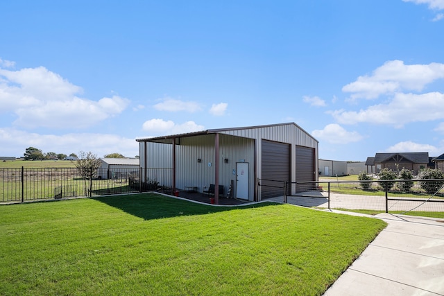 view of outbuilding with a garage and a lawn