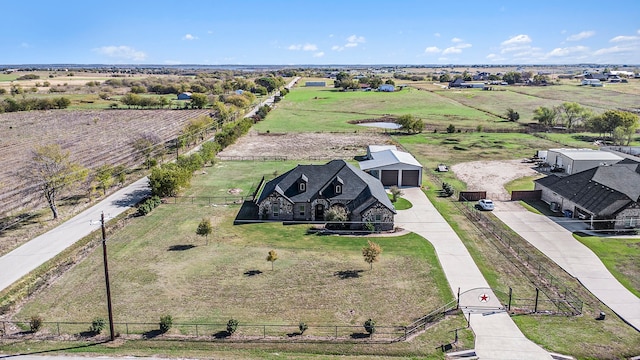 birds eye view of property featuring a rural view