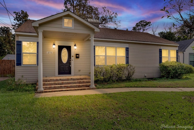 view of front of house with a lawn