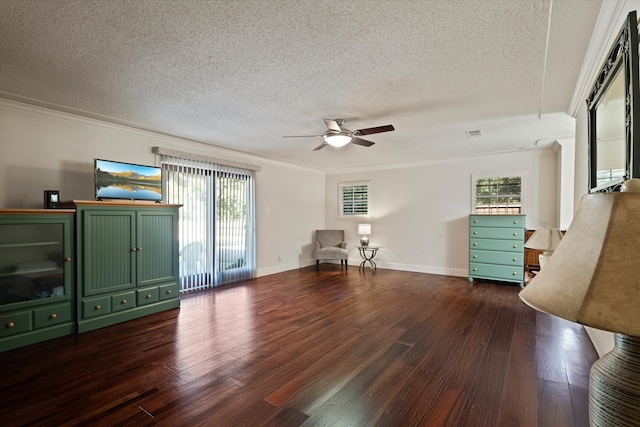 unfurnished room featuring a textured ceiling, ceiling fan, dark hardwood / wood-style floors, and ornamental molding