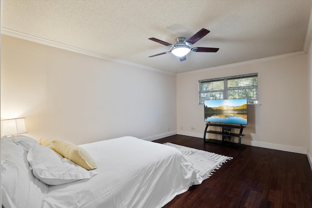 bedroom with ceiling fan, dark hardwood / wood-style flooring, a textured ceiling, and ornamental molding