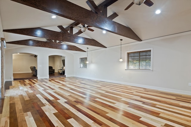 interior space featuring beamed ceiling, light hardwood / wood-style floors, and high vaulted ceiling