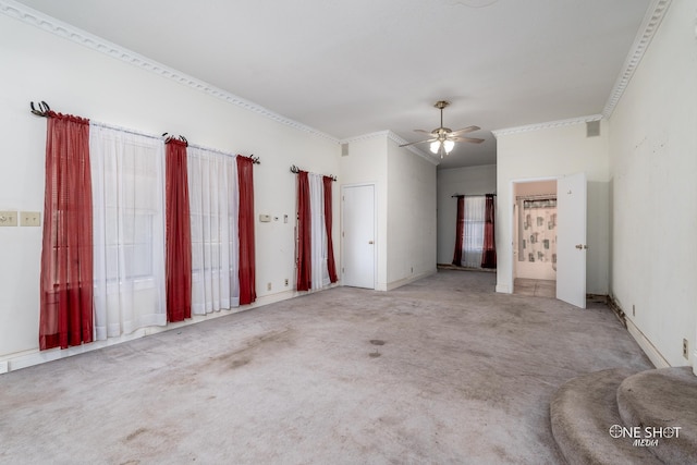 unfurnished bedroom featuring light carpet, ceiling fan, and crown molding