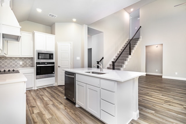 kitchen featuring white cabinetry, sink, appliances with stainless steel finishes, and tasteful backsplash