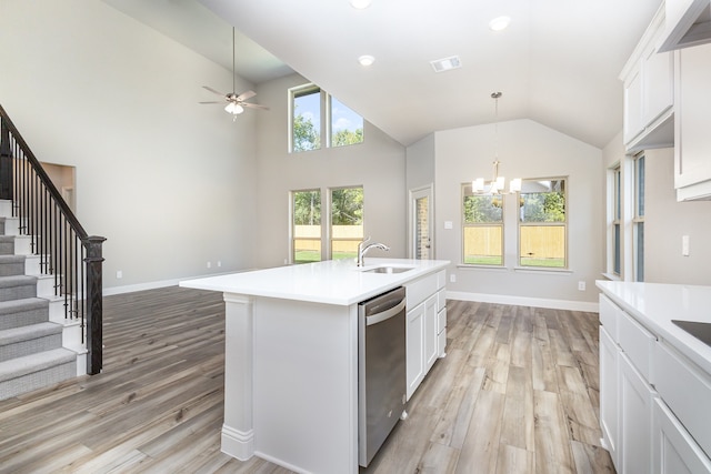 kitchen featuring dishwasher, a center island with sink, white cabinets, sink, and light hardwood / wood-style floors