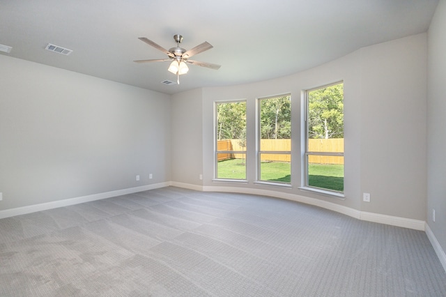 carpeted empty room with ceiling fan