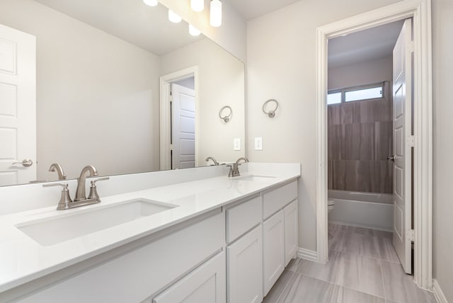 full bathroom with shower / tub combination, tile patterned floors, vanity, and toilet