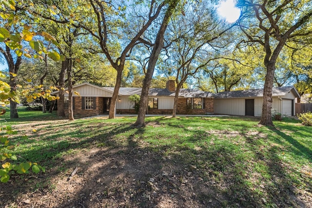 view of front of property with a garage and a front yard