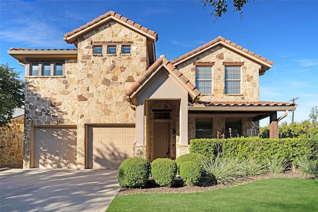 mediterranean / spanish house featuring a garage