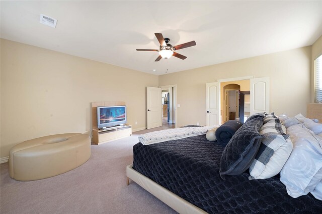 carpeted bedroom featuring ceiling fan