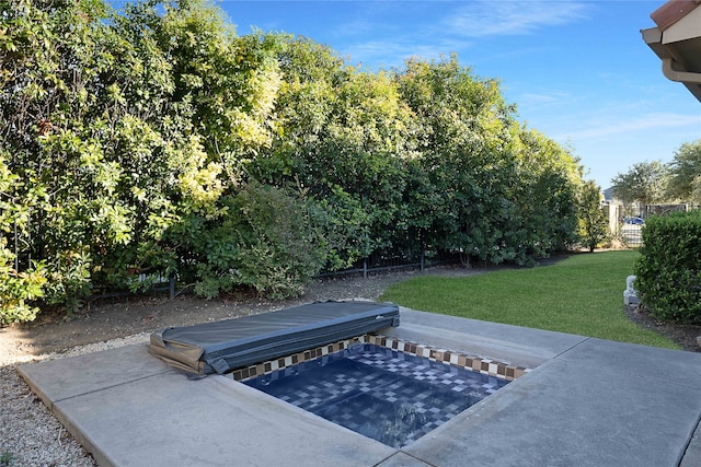 view of pool featuring a yard