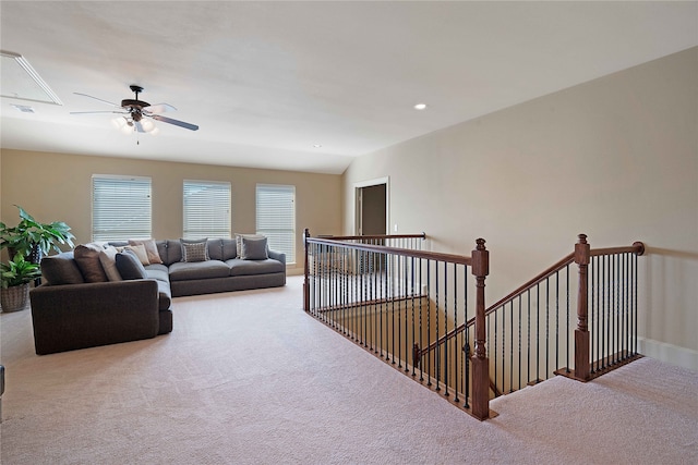 living room featuring carpet floors and vaulted ceiling