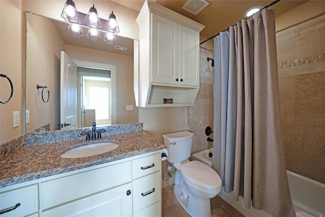 full bathroom featuring toilet, shower / bath combination with curtain, vanity, and tile patterned floors