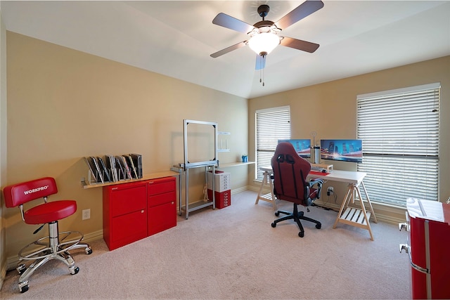 carpeted office featuring ceiling fan