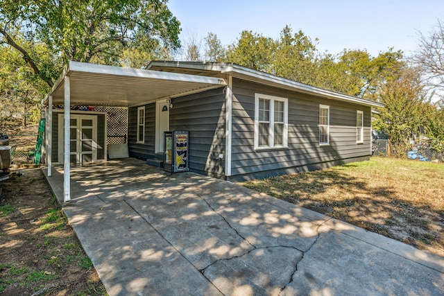 exterior space with a carport