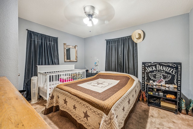 carpeted bedroom featuring ceiling fan