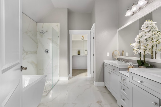 bathroom featuring a marble finish shower, marble finish floor, vanity, and baseboards