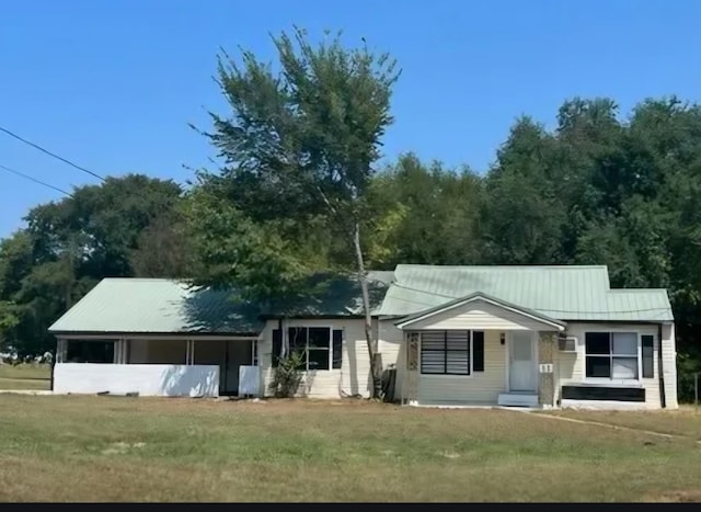 ranch-style house with a front lawn