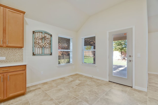 spare room with ceiling fan and lofted ceiling