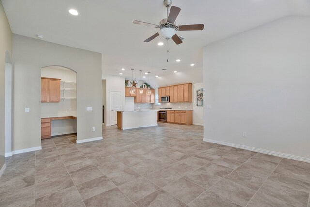 unfurnished living room with light tile patterned floors, ceiling fan, and sink