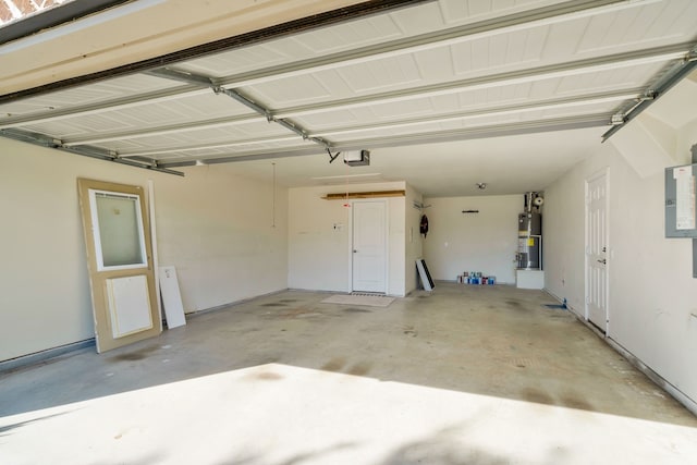 garage featuring gas water heater and a garage door opener