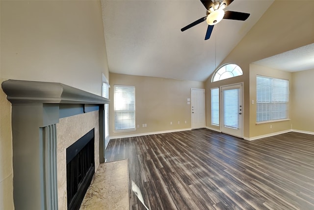 unfurnished living room featuring wood-type flooring, a textured ceiling, high vaulted ceiling, and ceiling fan