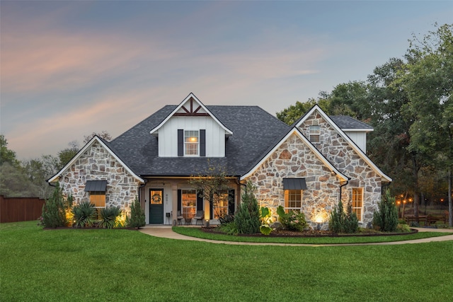 view of front of home with a yard