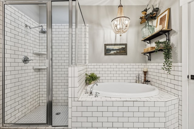 bathroom featuring shower with separate bathtub