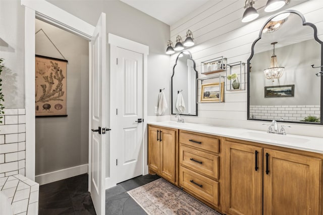 bathroom featuring wooden walls, tile patterned flooring, and vanity