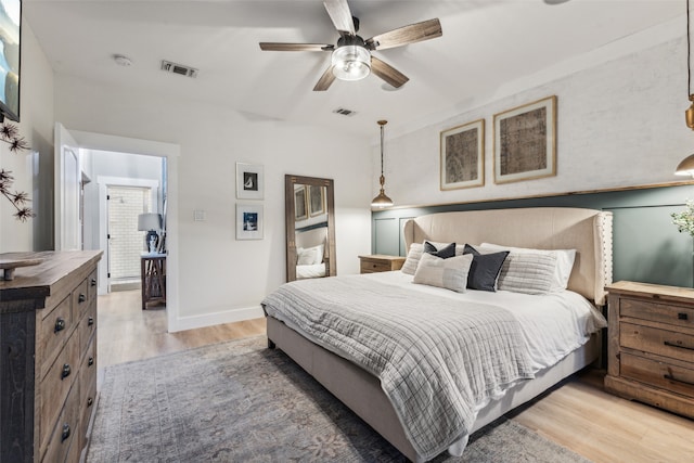 bedroom with wood-type flooring and ceiling fan