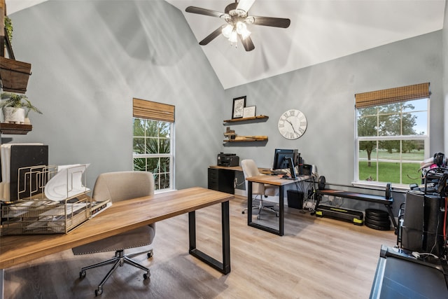 office space with ceiling fan, light wood-type flooring, and lofted ceiling