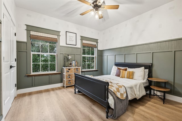 bedroom featuring light wood-type flooring and ceiling fan