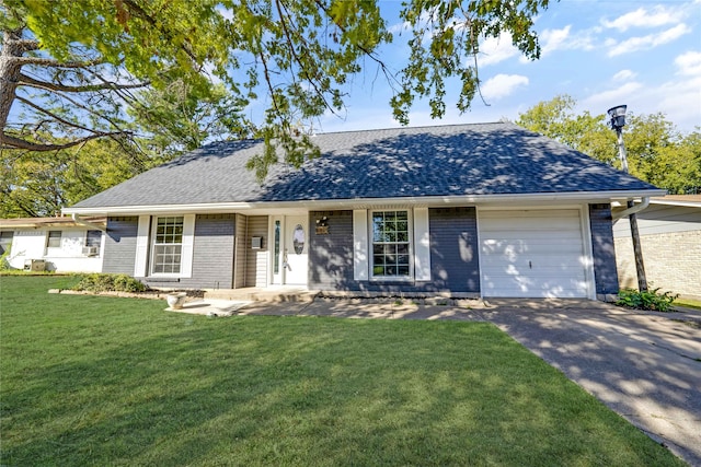 ranch-style home with a front lawn and a garage