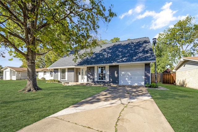 ranch-style house featuring a garage and a front yard