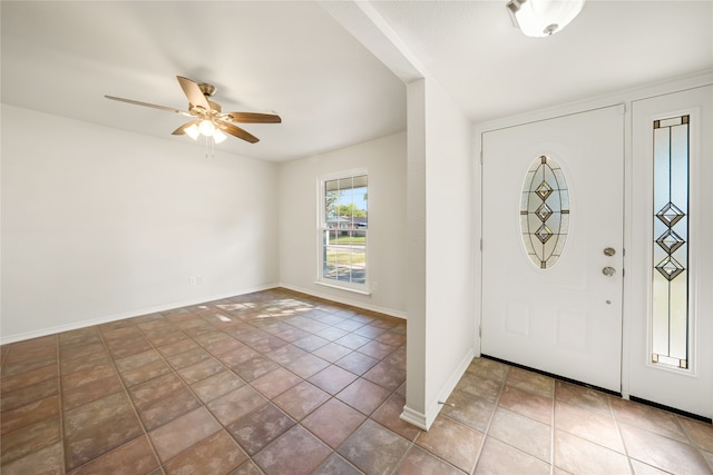 foyer entrance featuring tile patterned floors and ceiling fan