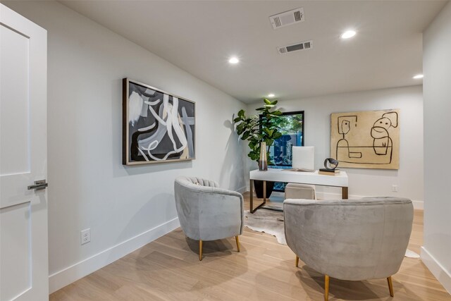 office space with hardwood / wood-style floors