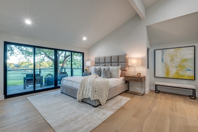 bedroom featuring access to exterior, light wood-type flooring, high vaulted ceiling, and beamed ceiling